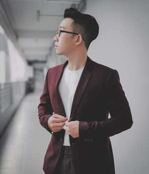 Model in burgundy tight blazer