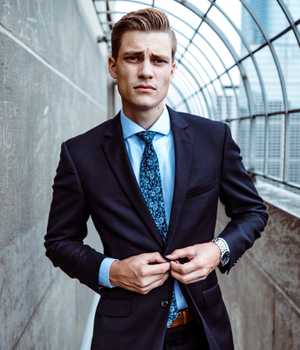 Model in tight but plain darkblue suit